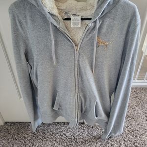 Pink Victoria  Faux lined jacket. Gray/ White inside. Gold lettering.